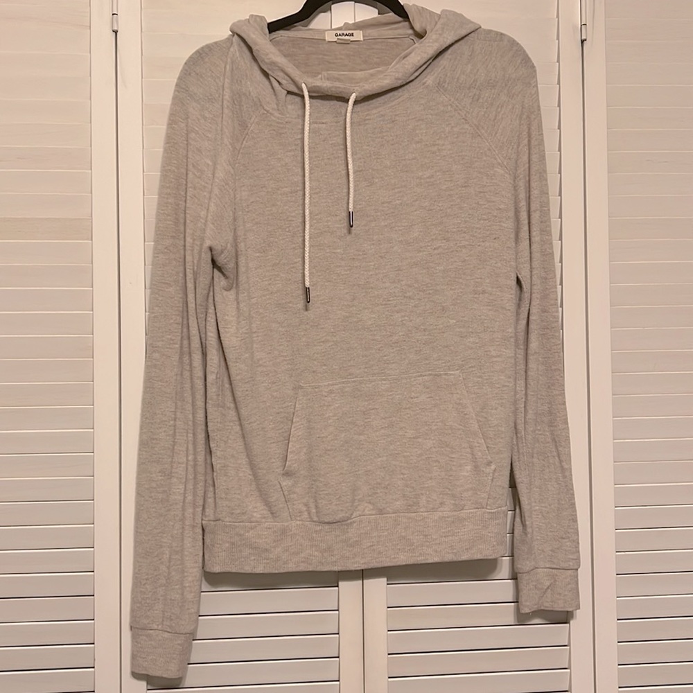 Tan hoodie by garage - Picture 1 of 4